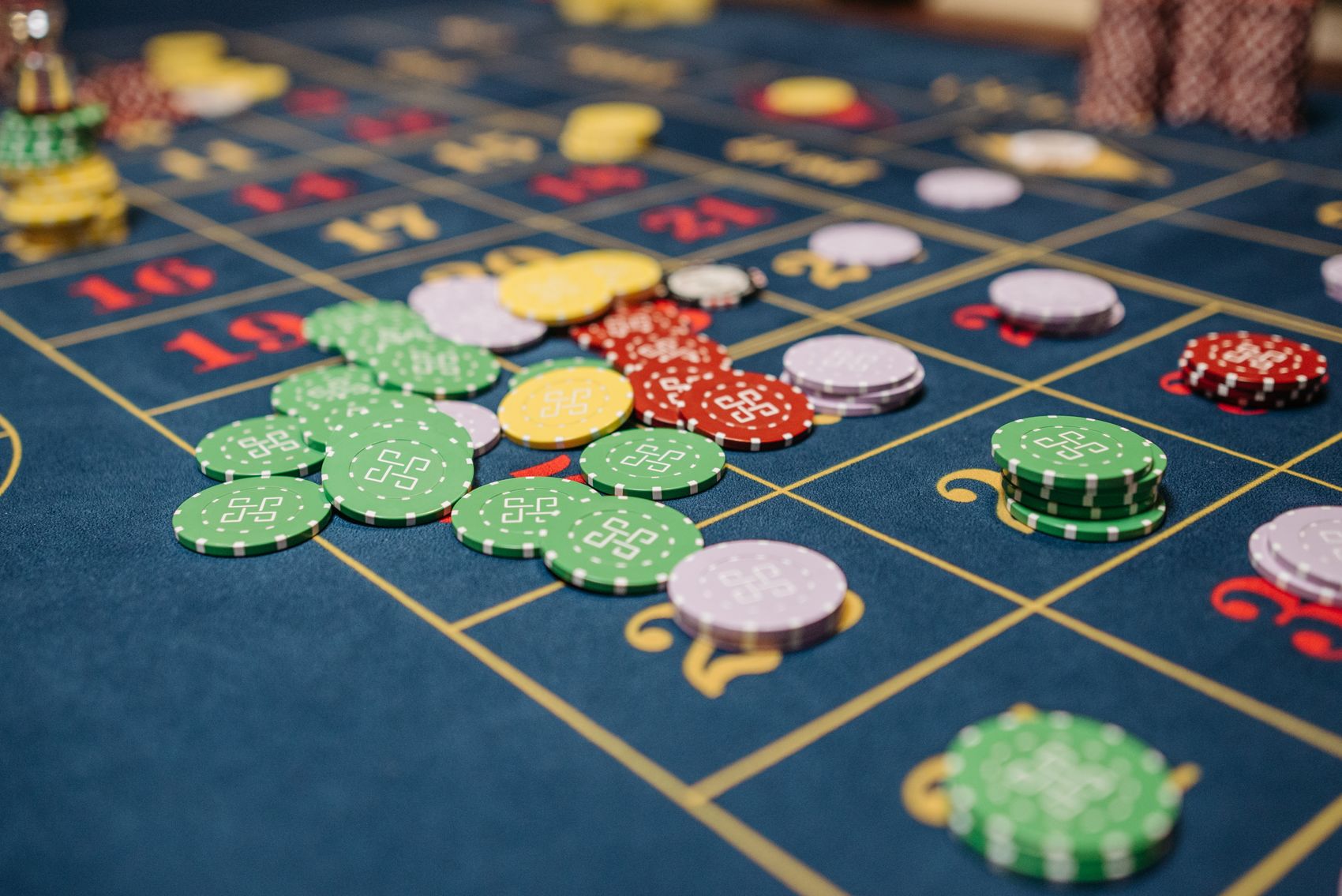 Casino chips on a roulette table used as illustrative stock imagery